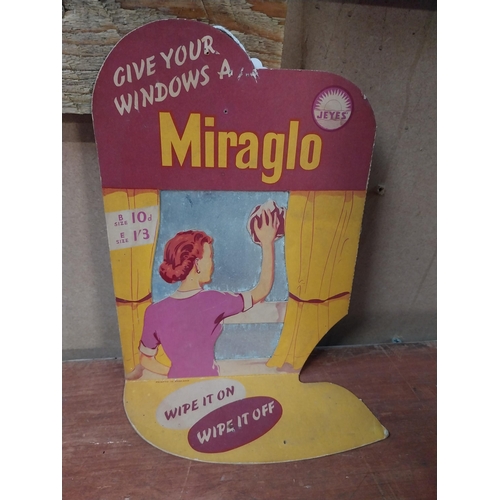 389 - Give Your Windows a Miraglo cardboard advertising showcard. {31 cm H x 18 cm W}