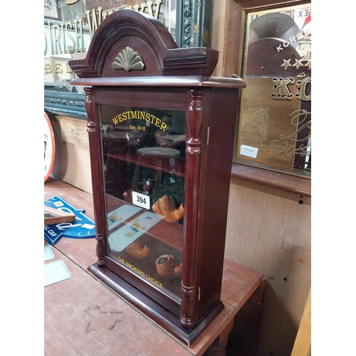 394 - Mahogany display cabinet Westminster Pipes including pipes. {52 cm H x 31 cm W}.