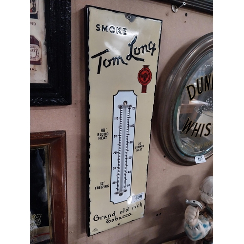 409 - Smoke Tom Long Grand old rich tobacco enamel advertising barometer. {57 cm H x 18 cm W}