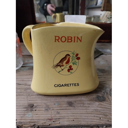 41 - Robin Cigarettes ceramic water jug. {12 cm H x 13 cm W x 11 cm D}.