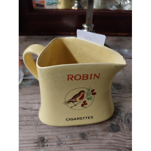 41 - Robin Cigarettes ceramic water jug. {12 cm H x 13 cm W x 11 cm D}.