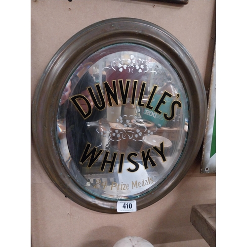 410 - Original Dunville's Whiskey oval mirror mounted in brass frame {44 cm H x 34 cm W}.