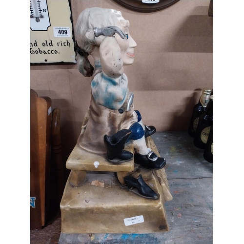 418 - Sandler of Boston Ruberoid Cobbler advertising figure. {46 cm H x 33 cm W x 20 cm D}