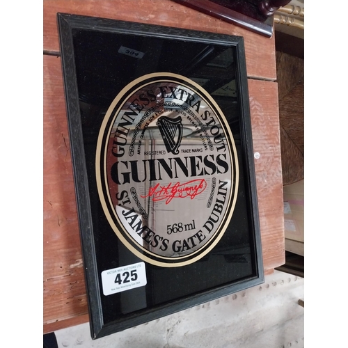 425 - Guinness Extra Stout framed advertising mirror. {32 cm H x 22 cm W}.