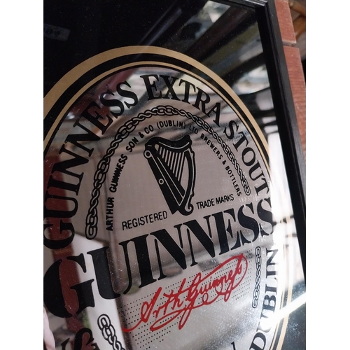 425 - Guinness Extra Stout framed advertising mirror. {32 cm H x 22 cm W}.