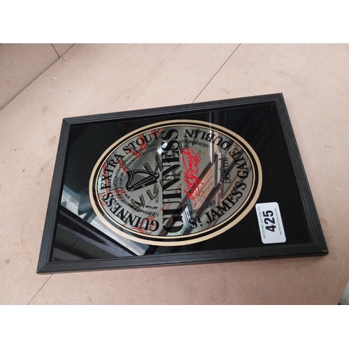 425 - Guinness Extra Stout framed advertising mirror. {32 cm H x 22 cm W}.