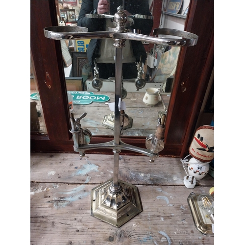 43 - Early 20th C. chrome and brass three bottle optic stand with original optics. {91 cm H x 31 cm W x 2... 