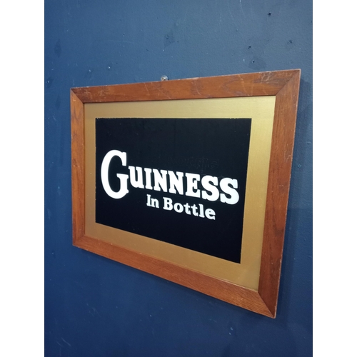 437A - Guinness in a bottle framed advertising print {H 43 cm x W 56cm }.