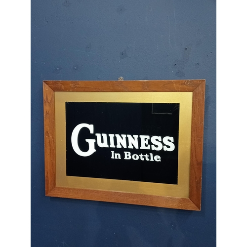 437A - Guinness in a bottle framed advertising print {H 43 cm x W 56cm }.