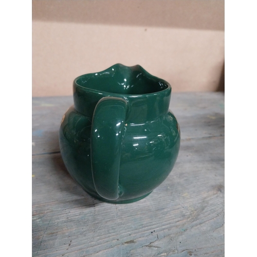 443 - Two Wade ceramic water jugs. {10 cm H x 15 cm W x 10 cm D}.