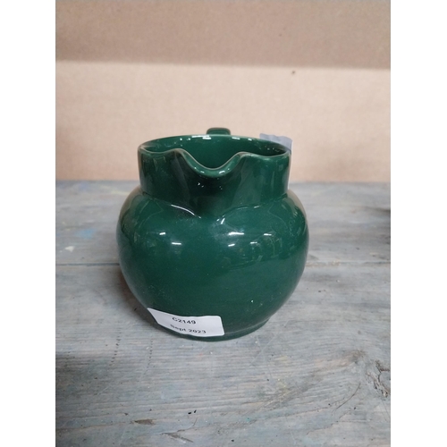 443 - Two Wade ceramic water jugs. {10 cm H x 15 cm W x 10 cm D}.