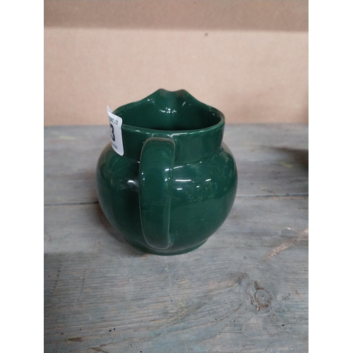 443 - Two Wade ceramic water jugs. {10 cm H x 15 cm W x 10 cm D}.