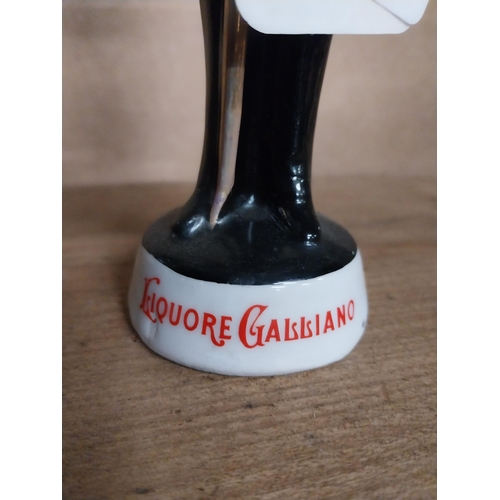 449 - Galliano Liqueur ceramic advertising figure. {22 cm H x 6 cm Dia.}.