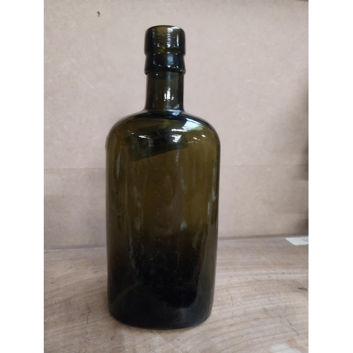 463 - Findlater Dublin rolled top half pint advertising bottle. {19 cm H x 8 cm W x 5 cm D}