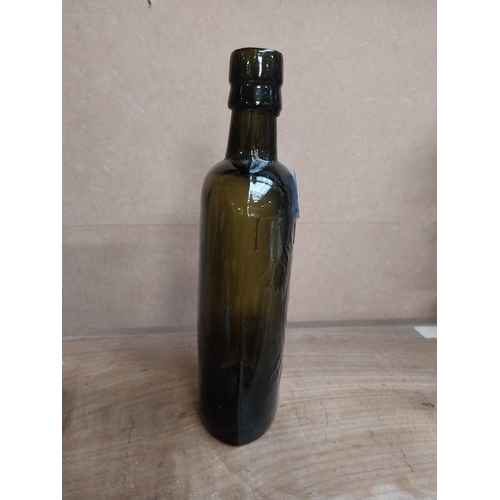 463 - Findlater Dublin rolled top half pint advertising bottle. {19 cm H x 8 cm W x 5 cm D}