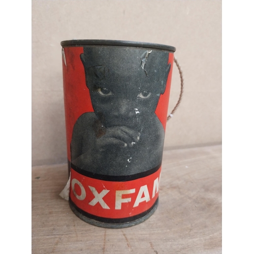 468 - Oxfam Oxford Committee collection tin. {14 cm H x 9 cm Dia.}.