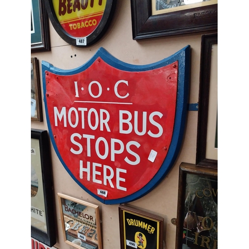 488 - IOC Motor Bus Stops Here enamel and wooden sign in the form of Shield. {59 cm H x 57 cm W}