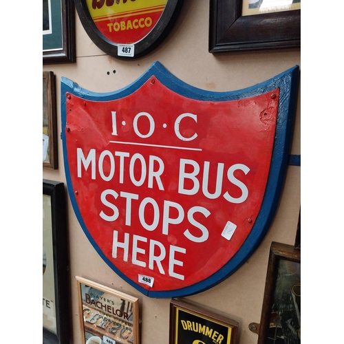 488 - IOC Motor Bus Stops Here enamel and wooden sign in the form of Shield. {59 cm H x 57 cm W}