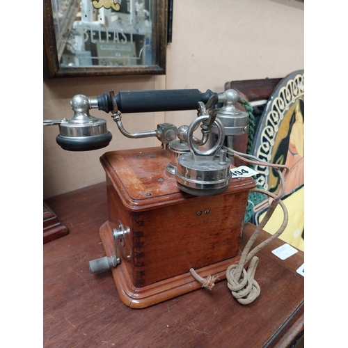 494 - Early 1900's mahogany and chrome telephone. {24 cm H x 19 cm W x 19 cm D}