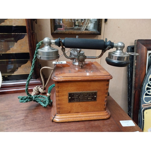 494 - Early 1900's mahogany and chrome telephone. {24 cm H x 19 cm W x 19 cm D}