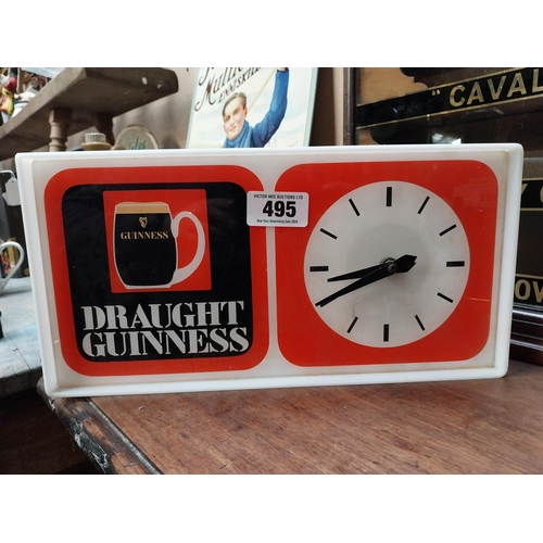 495 - 1970's Draught Guinness Perspex battery advertising clock. {18 cm H x 36 cm W x 7 cm D}.