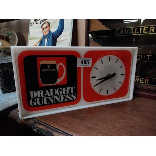 495 - 1970's Draught Guinness Perspex battery advertising clock. {18 cm H x 36 cm W x 7 cm D}.