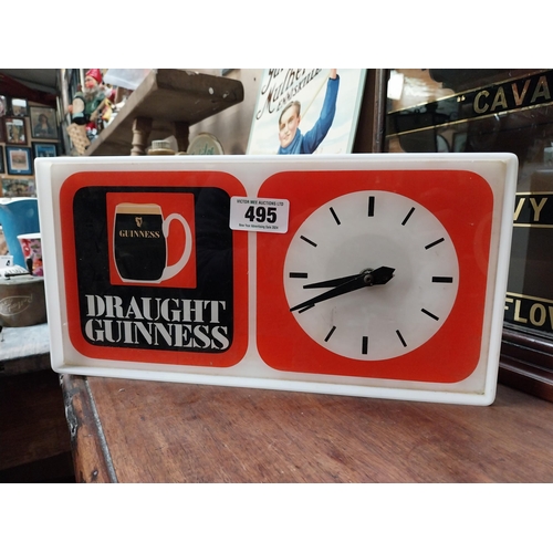 495 - 1970's Draught Guinness Perspex battery advertising clock. {18 cm H x 36 cm W x 7 cm D}.