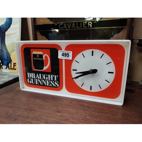 495 - 1970's Draught Guinness Perspex battery advertising clock. {18 cm H x 36 cm W x 7 cm D}.