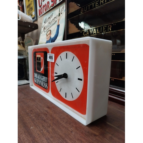 495 - 1970's Draught Guinness Perspex battery advertising clock. {18 cm H x 36 cm W x 7 cm D}.