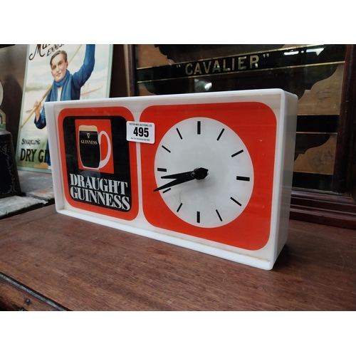 495 - 1970's Draught Guinness Perspex battery advertising clock. {18 cm H x 36 cm W x 7 cm D}.