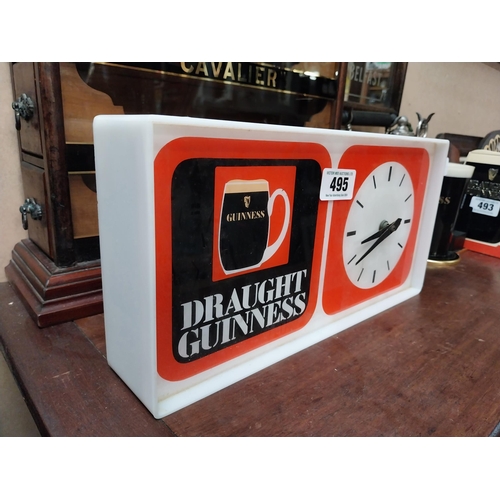 495 - 1970's Draught Guinness Perspex battery advertising clock. {18 cm H x 36 cm W x 7 cm D}.