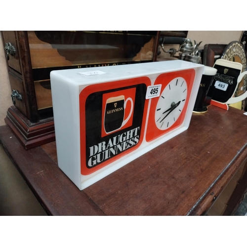 495 - 1970's Draught Guinness Perspex battery advertising clock. {18 cm H x 36 cm W x 7 cm D}.