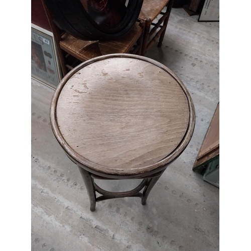 503 - Two bentwood bar stools. {80 cm H x 37 cm Dia.}.