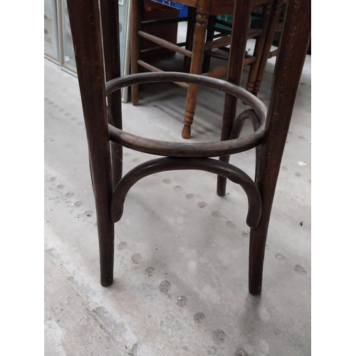 503 - Two bentwood bar stools. {80 cm H x 37 cm Dia.}.