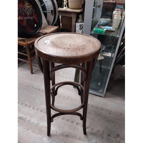 503 - Two bentwood bar stools. {80 cm H x 37 cm Dia.}.