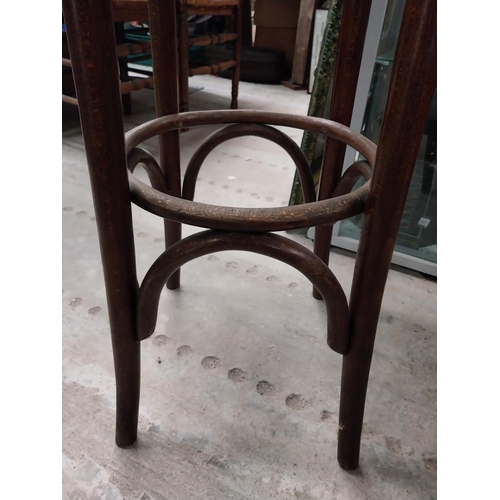 503 - Two bentwood bar stools. {80 cm H x 37 cm Dia.}.