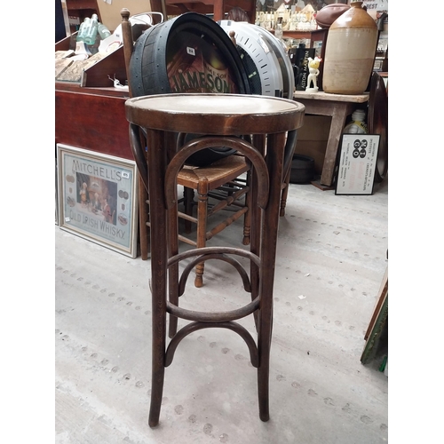 503 - Two bentwood bar stools. {80 cm H x 37 cm Dia.}.