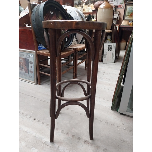 506 - Two bentwood bar stools. {80 cm H x 37 cm Dia.}.