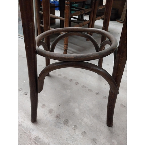 506 - Two bentwood bar stools. {80 cm H x 37 cm Dia.}.