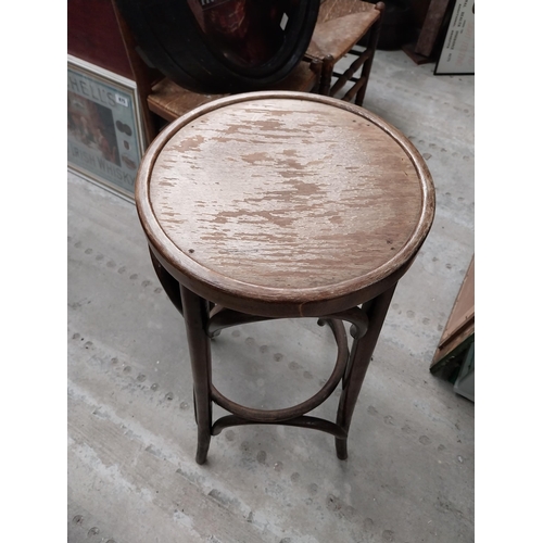 506 - Two bentwood bar stools. {80 cm H x 37 cm Dia.}.