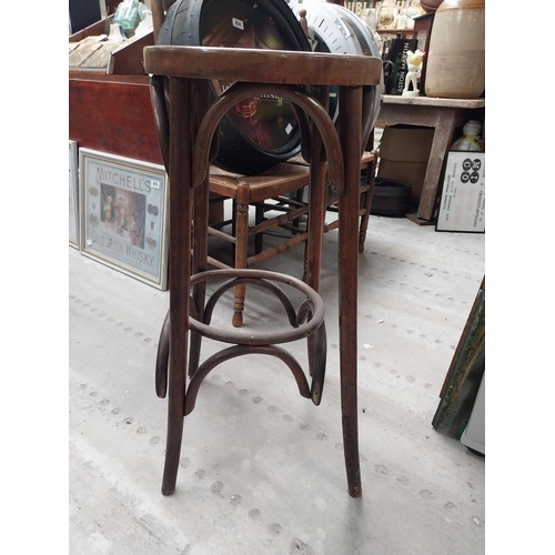 506 - Two bentwood bar stools. {80 cm H x 37 cm Dia.}.