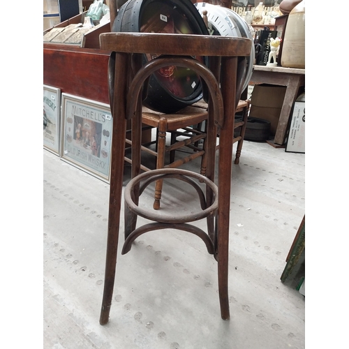 506 - Two bentwood bar stools. {80 cm H x 37 cm Dia.}.