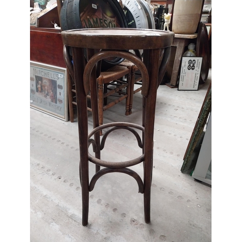 506 - Two bentwood bar stools. {80 cm H x 37 cm Dia.}.