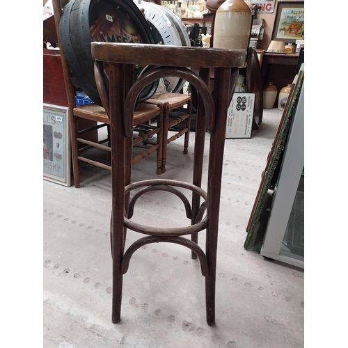 506 - Two bentwood bar stools. {80 cm H x 37 cm Dia.}.