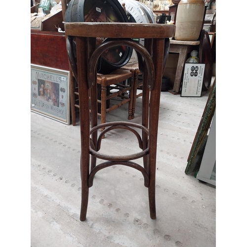 507 - Two bentwood bar stools. {80 cm H x 37 cm Dia.}.