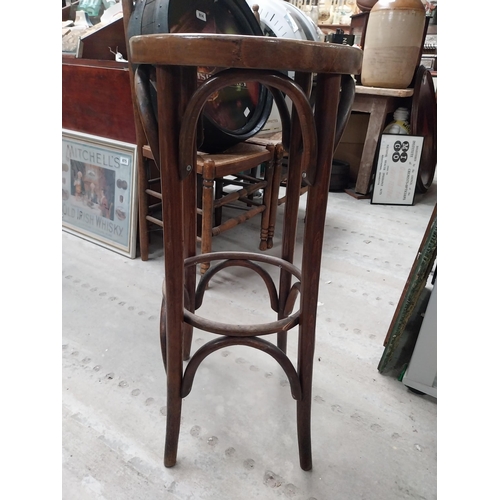 507 - Two bentwood bar stools. {80 cm H x 37 cm Dia.}.