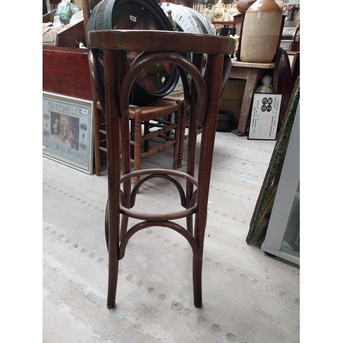 507 - Two bentwood bar stools. {80 cm H x 37 cm Dia.}.