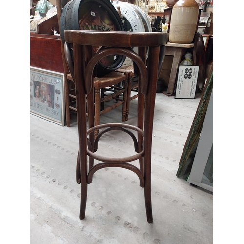 507 - Two bentwood bar stools. {80 cm H x 37 cm Dia.}.