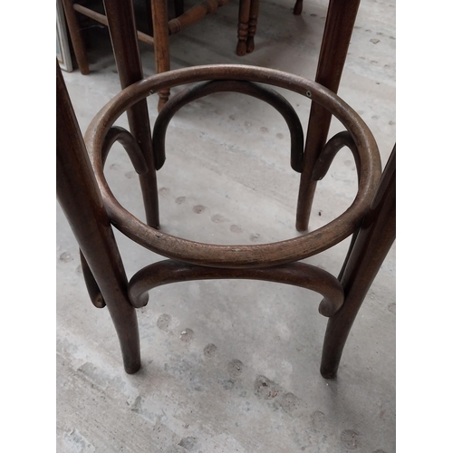 507 - Two bentwood bar stools. {80 cm H x 37 cm Dia.}.