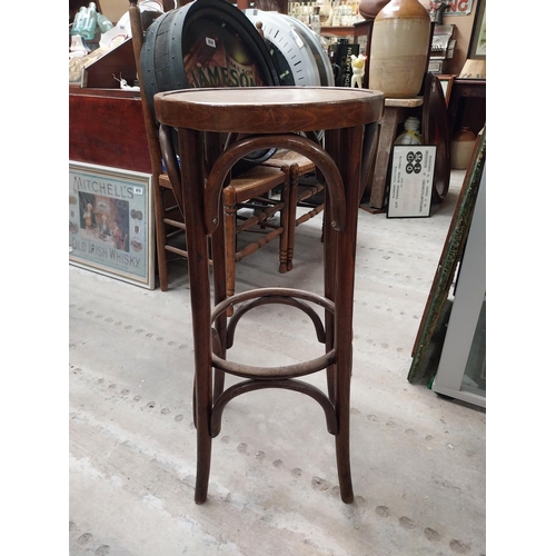 507 - Two bentwood bar stools. {80 cm H x 37 cm Dia.}.